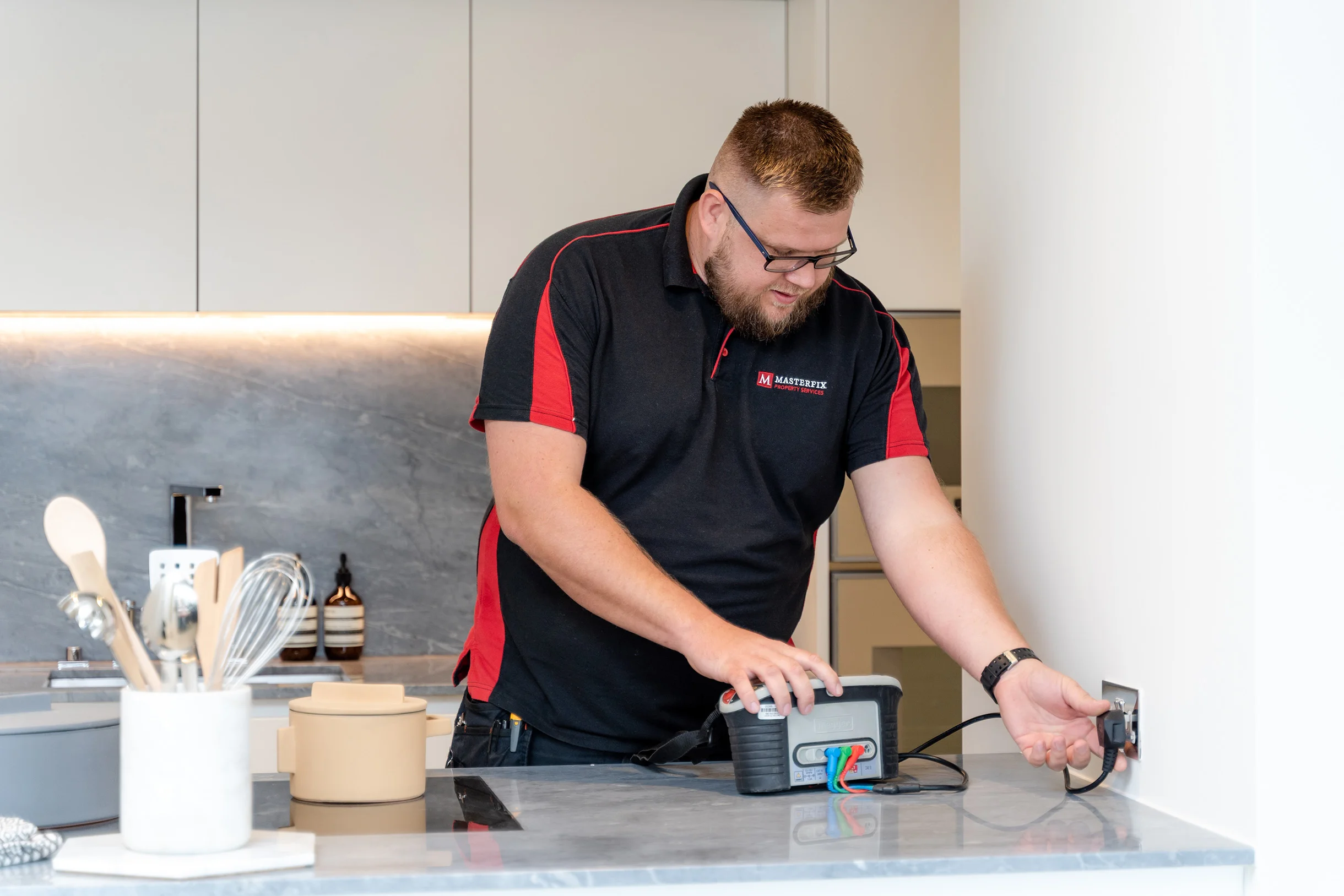 engineer testing a plug socket